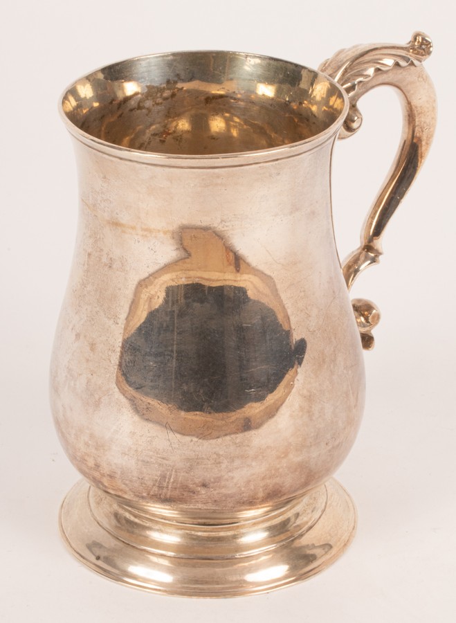 A George III silver tankard, William Collings, London 1775, of plain form on a circular base, 13.