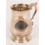A George III silver tankard, William Collings, London 1775, of plain form on a circular base, 13.