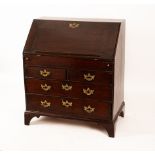 A George II oak bureau with fall-front enclosing pigeon holes and drawers,