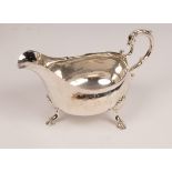 A George III silver sauce boat, makers mark worn, Dublin 1775, with scroll handle,