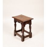 A Charles II oak joint stool, with later top, 49cm wide,
