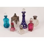 Four silver mounted glass scent bottles and stoppers and three other coloured glass scent bottles