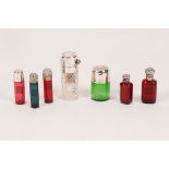 Various cylindrical clear and coloured glass scent bottles,