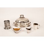 A silver plated meat dome, a plated wine bottle holder,