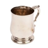 A George II silver mug, John Arnell, London 1759, of baluster shape with leaf capped scroll handle,