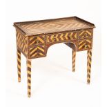 An early Victorian kneehole washstand painted to simulate zebra wood,