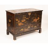 An George III lacquered chest, chinoiserie decorated with pagodas, lakes, trees,