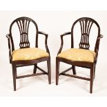 A pair of 19th Century mahogany framed open armchairs, with drop in seats,