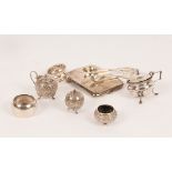 A quantity of silver comprising two napkin rings, a cigarette case, an Indian three-piece cruet,