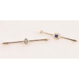 An Edwardian bar brooch centred by a square sapphire with pearls to each side (one missing),