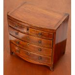 A 19th Century mahogany bowfronted apprentice chest, four long drawers on bracket feet, 30.