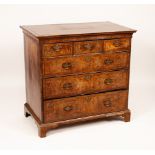 An early 18th Century walnut chest of three short and three long drawers,