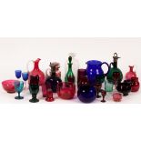 A collection of coloured glass drink ware, to include decanters, jugs,