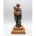 A polychrome painted figure of the Madonna and Child, 18th Century and later carved, 36cm high,
