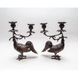 A pair of 19th Century Japanese bronze two-branch table lights, each in the form of a cockerel,