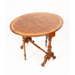 A Victorian burr walnut Sutherland table, with floral inlay, shaped supports on casters, 76cm wide,