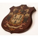 A painted wooden armorial shield for the Luck family of Rotherfield and Mayfield, Sussex, 36cm x 30.