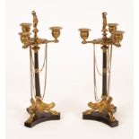 A pair of Regency style table candelabra, with figural surmount,