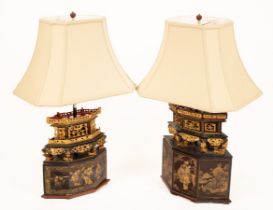 Two Chinese carved and lacquered lamp bases with cream shaped shades,