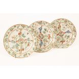 Three Chinese plates, 19th Century, decorated with figures, birds and blossom,