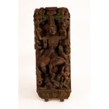 A carved relief panel depicting Shiva, polychrome decorated,