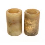 Two Chinese jade brush pots, late Qing, of plain cylinder form, 10.5cm and 10.