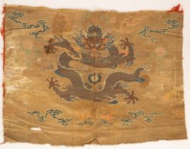 A Chinese silk panel, the ivory ground with a five clawed dragon,