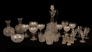 A suite of 20th Century glassware decorated with flat diamond-point cutting, comprising a decanter,