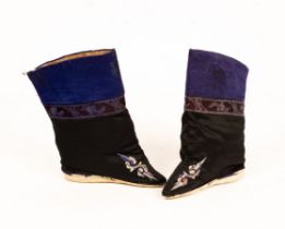 A pair of bound boots, circa 1920,