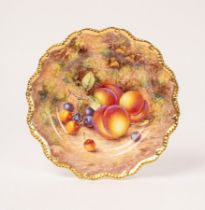 A Royal Worcester cabinet plate painted by Freeman with peaches and cherries,