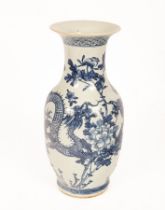 A Chinese blue and white vase, 19th Century, baluster shaped, decorated with dragon amongst blossom,