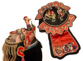 A Chinese embroidered hat, decorated with chicken and tassels, approximately 15.