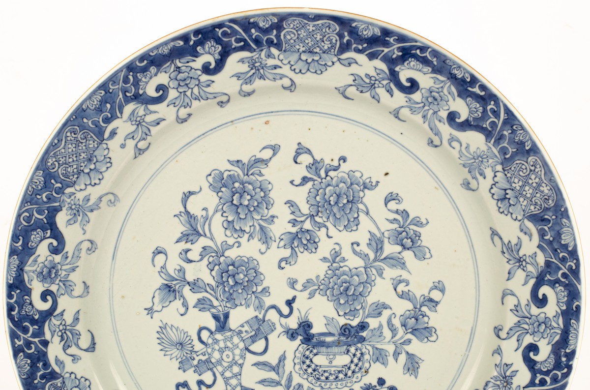 A Chinese blue and white charger, Qing dynasty, typically decorated with vase and flowers, - Image 2 of 7