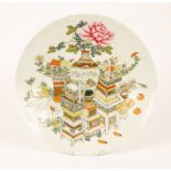 A Chinese polychrome porcelain charger, 20th Century, decorated with vase and planters with flowers,