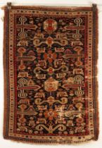 A Perepedil rug, South Caucasus, circa 1910, the deep abrashed indigo and charcoal field,