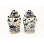 A pair of Chinese blue and white baluster jars and covers,