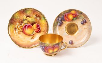 A Royal Worcester cabinet cup and saucer painted by Freeman with peaches and cherries,