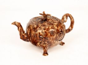 An English creamware Whieldon type tortoiseshell-glazed globular teapot and cover,