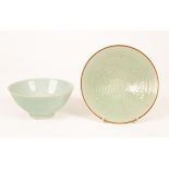 A Chinese celadon dish with incised decoration,