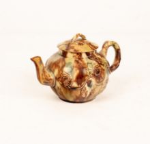 An English creamware Whieldon type globular teapot and cover, decorated in brown,