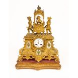 A 19th Century French gilt metal mounted mantel clock surmounted by a lady in a sedan chair with