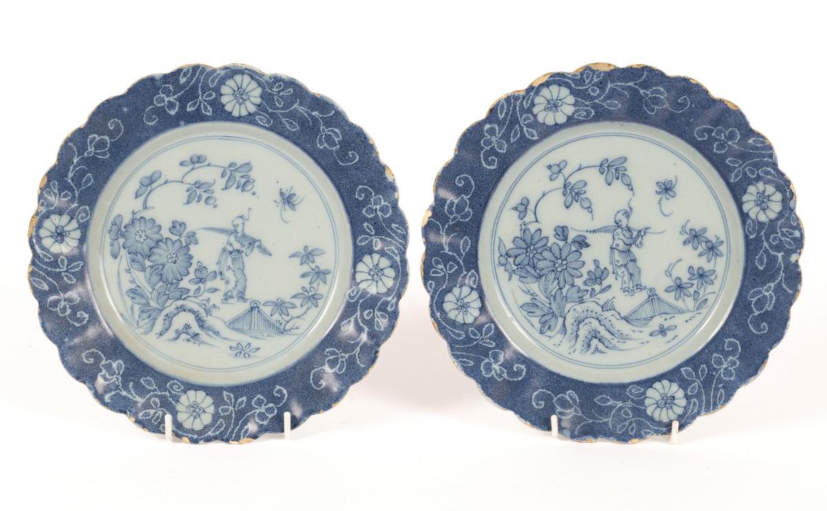 A pair of English Delftware blue and white powder ground plates, circa 1760,