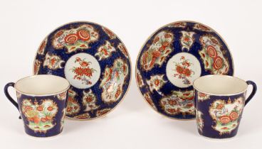 A pair of Worcester blue scale ground Kakiemon pattern cups and saucers, circa 1760,