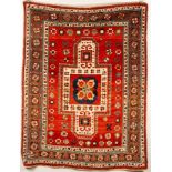 A Sewan Kazak rug, South Caucasus, circa 1890, the madder field of stellar and flowerhead motifs,