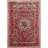 A Bakthiar carpet, West Persia, mid 20th Century, the madder field centred by an ivory medallion,