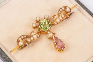 An Edwardian Suffragette style 15ct yellow gold peridot, pink tourmaline and seed pearl bar brooch