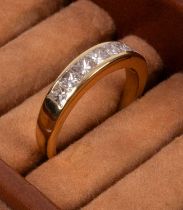 An 18ct yellow gold and diamond half-eternity ring