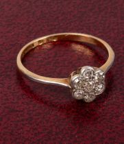 A diamond flowerhead cluster ring