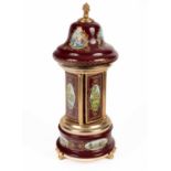 A enamelled and gilt metal musical carousel and cigarette dispenser