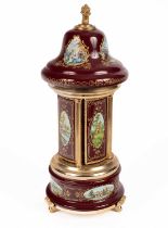 A enamelled and gilt metal musical carousel and cigarette dispenser